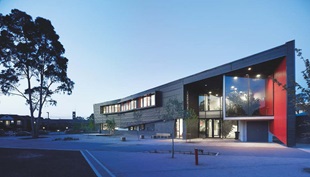 Steel plays a starring role at the entry to each SWIS, were a two-storey-high inverted L-shaped canopy is clad in Stramit Longspan® made from COLORBOND® steel that touches the ground